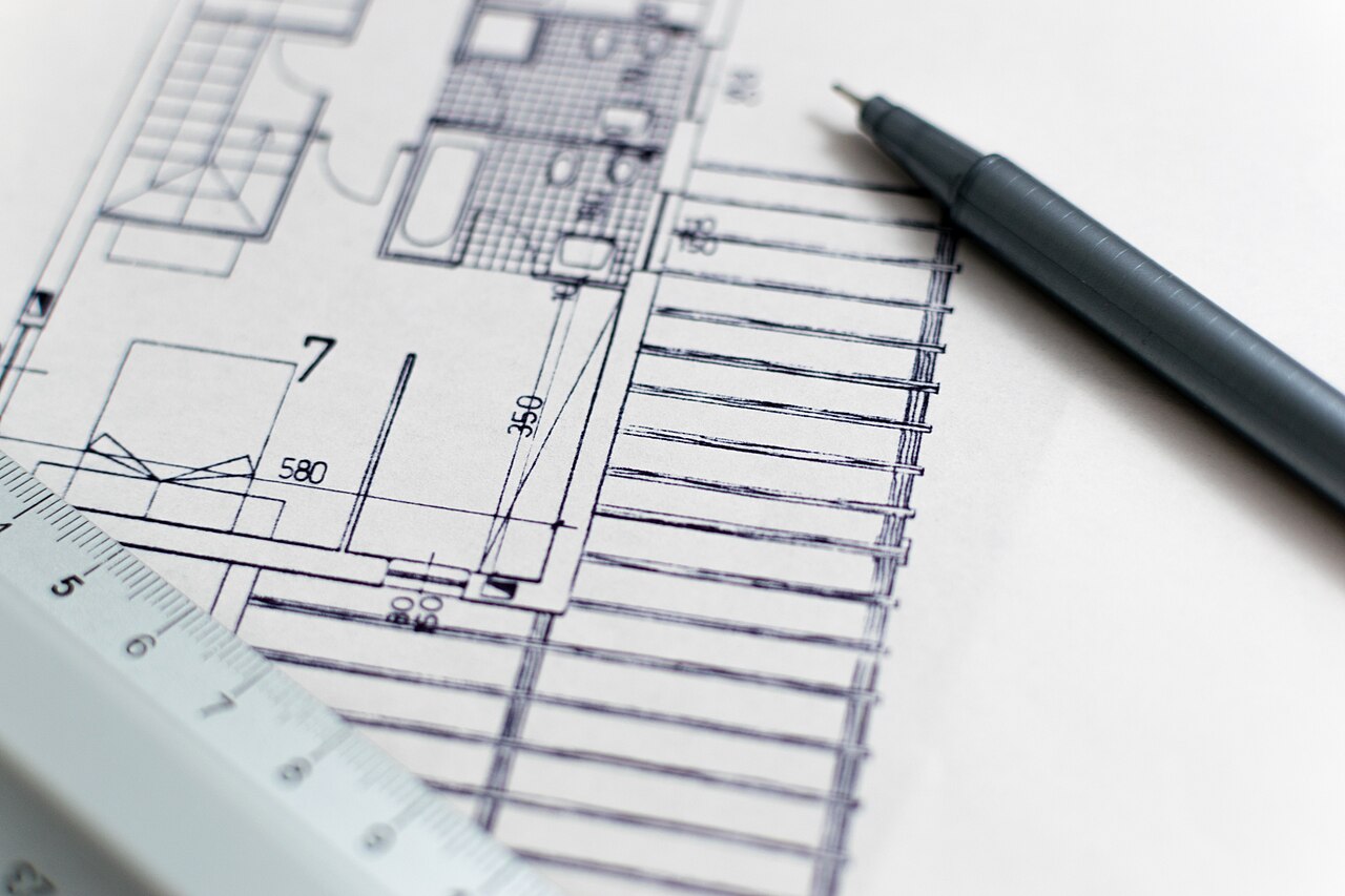 Architectural blueprint and drafting pencil representing the Architecture Audit planning process
